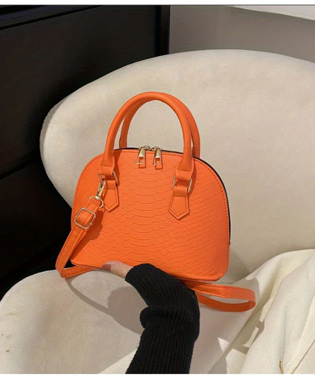 Mini Crocodile Embossed Dome Handbag.