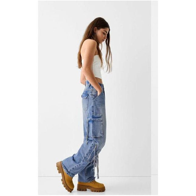 Denim baggy cargo jeans with straps.