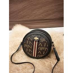 Leather elegant round waterproof ladies sling bag.